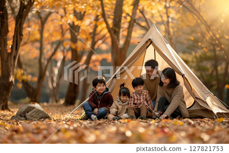 Family enjoying camping in autumn 127821753