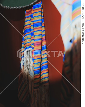 A Beautiful Array of Colorful Woven Textiles Stacked Stylishly in an EyeCatching Manner 127821836
