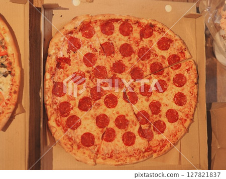 A mouthwatering Pepperoni Pizza is freshly prepared and ready for you to enjoy and serve A mouthwatering Pepperoni Pizza is freshly prepared and ready for you to enjoy and serve 127821837