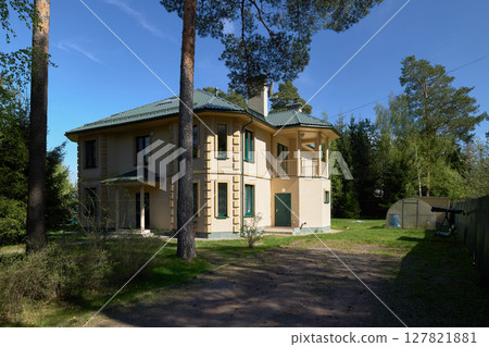 A Charming TwoStory House Nestled Perfectly and Surrounded by Lush Nature All Around 127821881