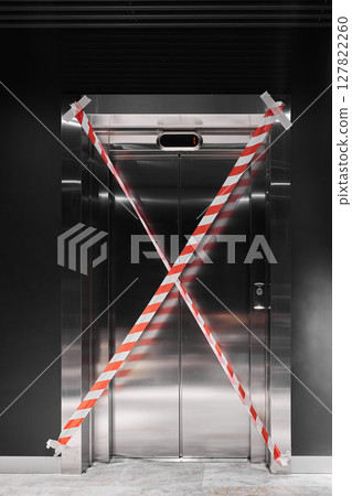 The elevator is currently out of service and is marked with barrier tape for safety reasons The elevator is currently out of service and is marked with barrier tape for safety reasons 127822260