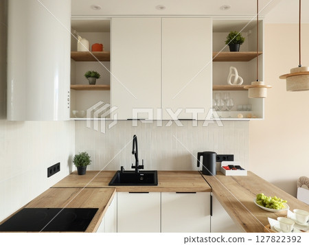 A Modern Kitchen Design that Features Chic Black and Beautiful Wood Accents for Style 127822392