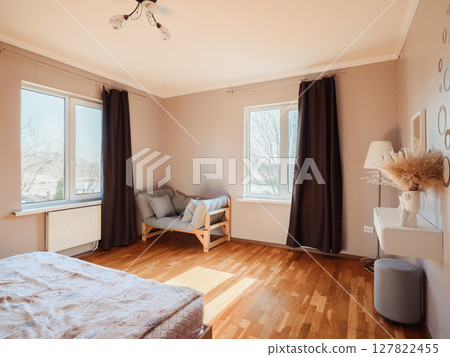 A Bright and Cozy Bedroom, filled with Natural Light, Elegant Decor, and Inviting Atmosphere A Bright and Cozy Bedroom, filled with Natural Light, Elegant Decor, and Inviting Atmosphere 127822455