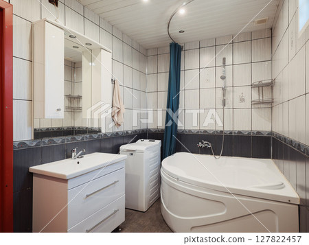 A Modern Bathroom featuring a Soothing Design along with Elegant Fixtures and Amenities A Modern Bathroom featuring a Soothing Design along with Elegant Fixtures and Amenities 127822457