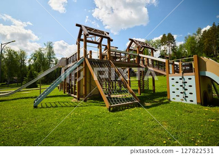 A Modern Playground featuring Exciting Slides and Inviting Climbing Structures for fun A Modern Playground featuring Exciting Slides and Inviting Climbing Structures for fun 127822531