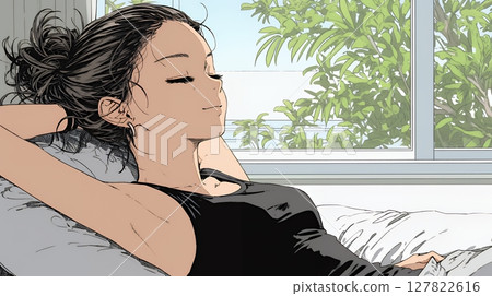 Relaxed and leisurely: A young woman relaxing in bed bathed in the morning sun Relaxed and leisurely: A young woman relaxing in bed bathed in the morning sun 127822616