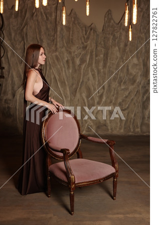 An Elegant Woman Posing in a Beautiful and Stylish Indoor Setting with a Captivating Ambiance 127822761