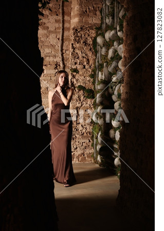 An Elegant Woman Gracefully Posing in a Unique and Captivating Setting That Inspires Awe An Elegant Woman Gracefully Posing in a Unique and Captivating Setting That Inspires Awe 127823082