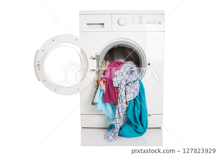 Washing machine with clean linen on a white background... 127823929