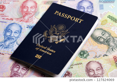 American passport on Vietnamese  Dong 127824069