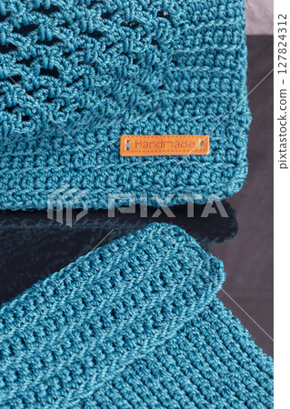 Knitting a product from a cord with a crochet hook. Step-by-step instructions 127824312