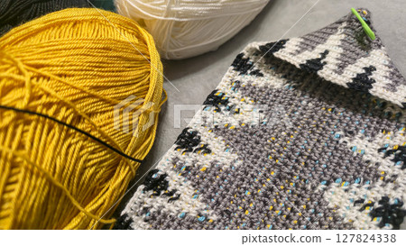 Knitting a bag from threads with a crochet hook. Step-by-step instructions 127824338