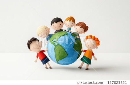 a group of stylized children surrounding a globe. some children are standing and holding onto the sides, while others are perched on top 127825831