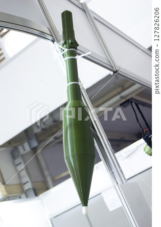 Shot for grenade launcher printed on 3D printer from melted plastic. Plastic grenade created on 3D printer. Prototype of ammunition printed on 3D printer. Innovation 3d printing. Innovation technology 127826206