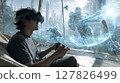 A young man enjoying a VR game in his living room 127826499