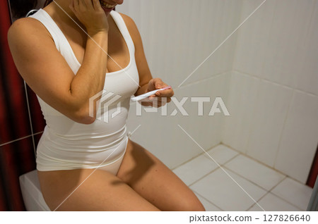 Woman upset by pregnancy test result. Woman upset by pregnancy test result. 127826640