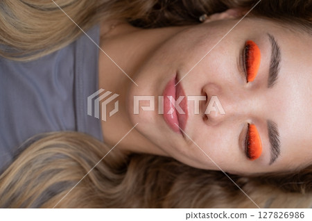 Caucasian woman undergoing eyelash lamination procedure. top view. Caucasian woman undergoing eyelash lamination procedure. top view. 127826986