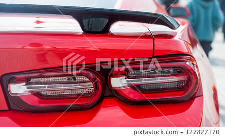 Sleek red Sports Car Rear with Red Lights. Sleek red Sports Car Rear with Red Lights. 127827170