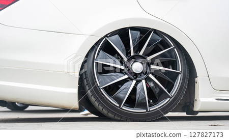 Close-Up of Custom Car Wheel and Tire Excellence.  127827173