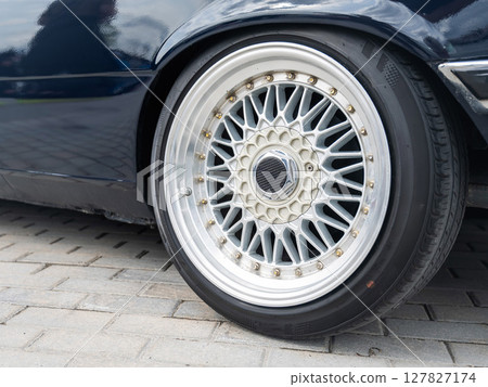 Close-Up of Custom Car Wheel and Tire Excellence.  127827174