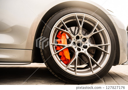 Close-Up of Custom Car Wheel and Tire Excellence. Close-Up of Custom Car Wheel and Tire Excellence. 127827176