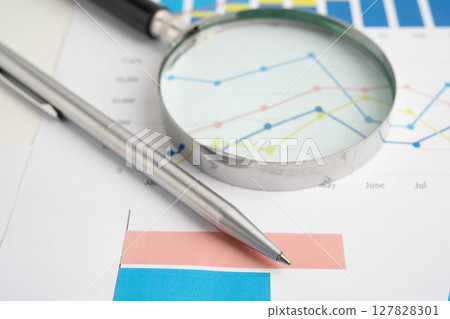 Magnifying glass on charts graphs paper. Financial development, Banking Account, Statistic, Investment Analytic research data economy. 127828301