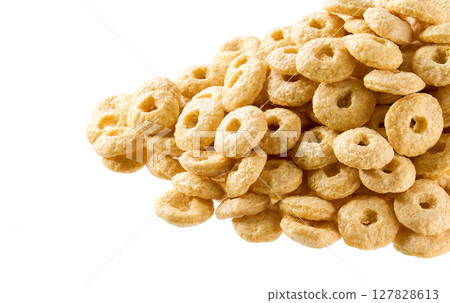 Whole grain cereal rings in a white background, close up. Crispy cereal loops in a white background. 127828613