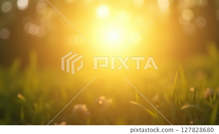 a bright orange sun setting over a field 127828680