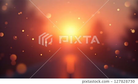 a bright orange sun setting over a field 127828730