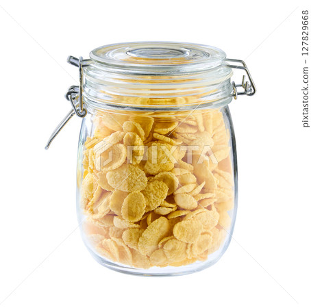glass jar with cornflakes isolated on a white background. glass jar with cornflakes isolated on a white background. 127829668