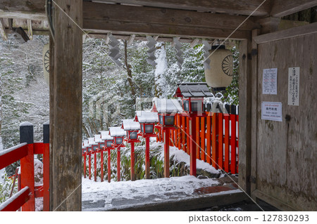 Kifune Shrine in winter: Vermilion lanterns and stone steps seen from the inner gate Kifune Shrine in winter: Vermilion lanterns and stone steps seen from the inner gate 127830293