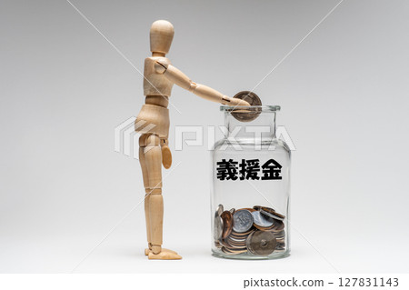 A drawing of a doll putting donations into a glass bottle A drawing of a doll putting donations into a glass bottle 127831143