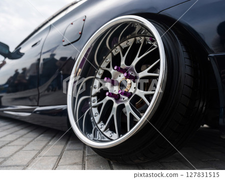 Close-Up of Custom Car Wheel and Tire Excellence.  127831515
