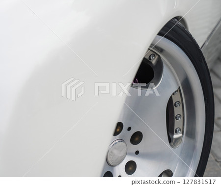 Close-Up of Custom Car Wheel and Tire Excellence. Close-Up of Custom Car Wheel and Tire Excellence. 127831517