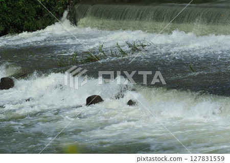 Flooding and rising water levels of rivers 127831559