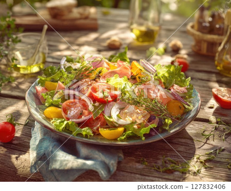 Mediterranean Inspired Fresh Garden Salad with Smoked Salmon, Heirloom Tomatoes, and Zesty Herbs A Rustic Outdoor Delight 127832406