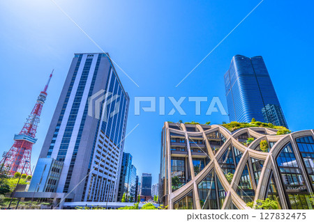 Tokyo cityscape in Japan: Towards a new era... (bustling with foreign tourists) View of Azabudai Hills and Tokyo Tower 127832475