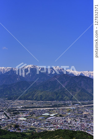 Omachi city and the Northern Alps as seen from Mount Takagari Omachi city and the Northern Alps as seen from Mount Takagari 127832571