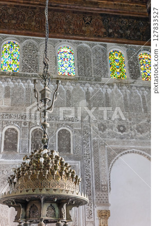 Ancient chandelier in Al-Attarine Madrasa in Fes, Morocco. Ancient chandelier in Al-Attarine Madrasa in Fes, Morocco. 127833527
