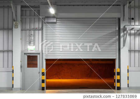 Shutter door in factory warehouse suit for industrial background. Shutter door in factory warehouse suit for industrial background. 127833869