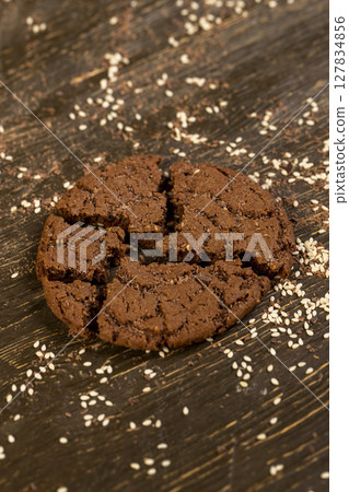 sweet chocolate biscuits on the kitchen , chocolate biscuits with real cocoa and sesame seeds. close up 127834856