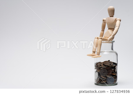 A drawing doll thinking about money 127834936