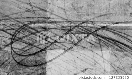 Aerial view car tire marks abstract street road background with black tire marks on race track, Texture and background car automobile and automotive skid tire marks. 127835920