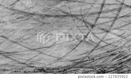 Aerial view car tire marks abstract street road background with black tire marks on race track, Texture and background car automobile and automotive skid tire marks. 127835922