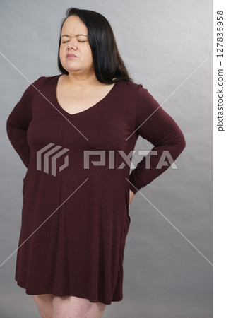 Woman having loins pain ache Woman having loins pain ache 127835958
