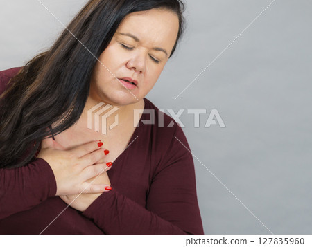 Adult woman having pain in chest Adult woman having pain in chest 127835960