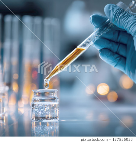 Precision in Progress Scientist's Hand Dispensing Liquid into Vial, Symbolizing Vaccine Development and Pharmaceutical Breakthroughs Precision in Progress Scientist's Hand Dispensing Liquid into Vial, Symbolizing Vaccine Development and Pharmaceutical Breakthroughs 127836033