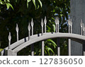 metal fence with arrows on the top 127836050
