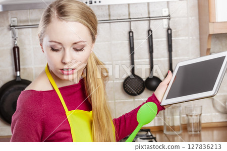 Woman having green vegetables thinking about cooking Woman having green vegetables thinking about cooking 127836213