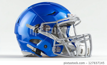 Bright blue football helmet on white boosts sports spirit Bright blue football helmet on white boosts sports spirit 127837145